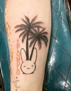Bad Bunny Tattoos - how many tattoos does bad bunny have