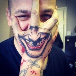 Joker Smile Tattoo - joker smile tattoo on face