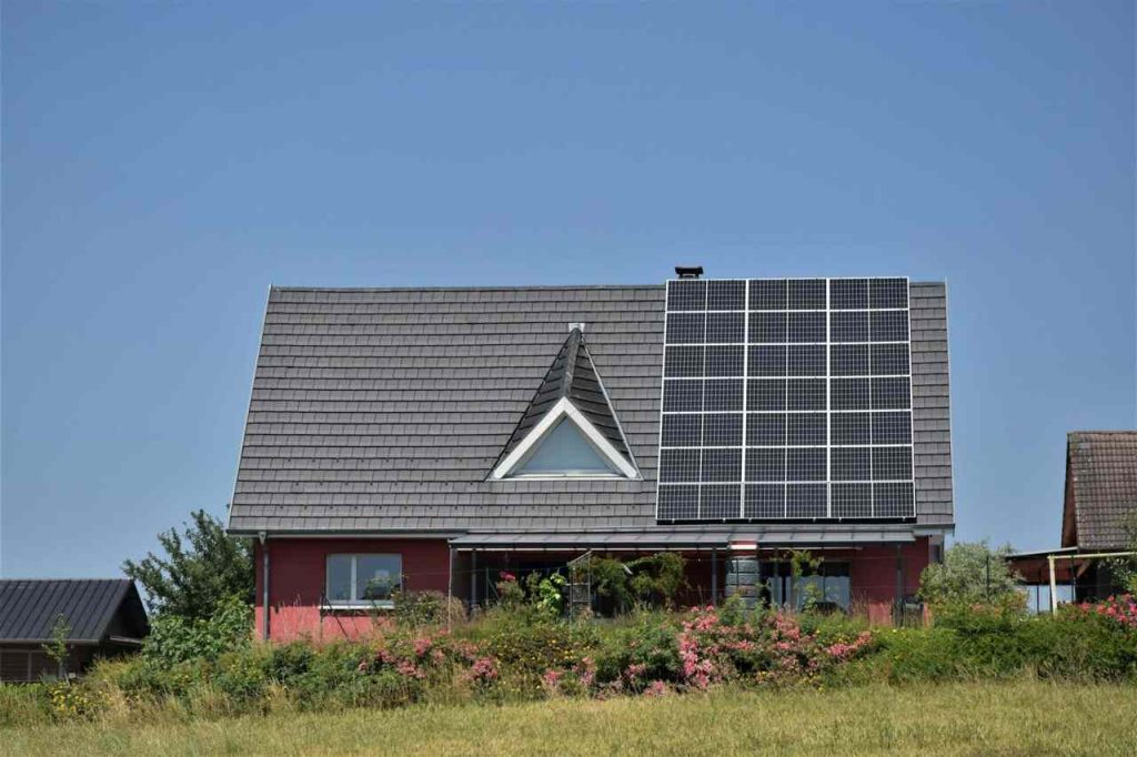 house with block of solar panels on the roof