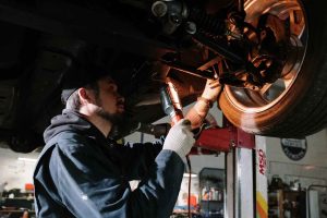 A Mechanic Working on Car