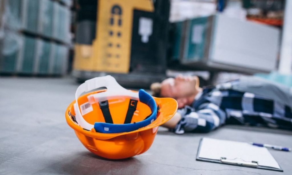 5 Serious Injuries a Worker May Sustain at a Construction Site Construction worker wearing a safety helmet and high-visibility vest at a construction site, emphasizing workplace safety to prevent serious injuries.