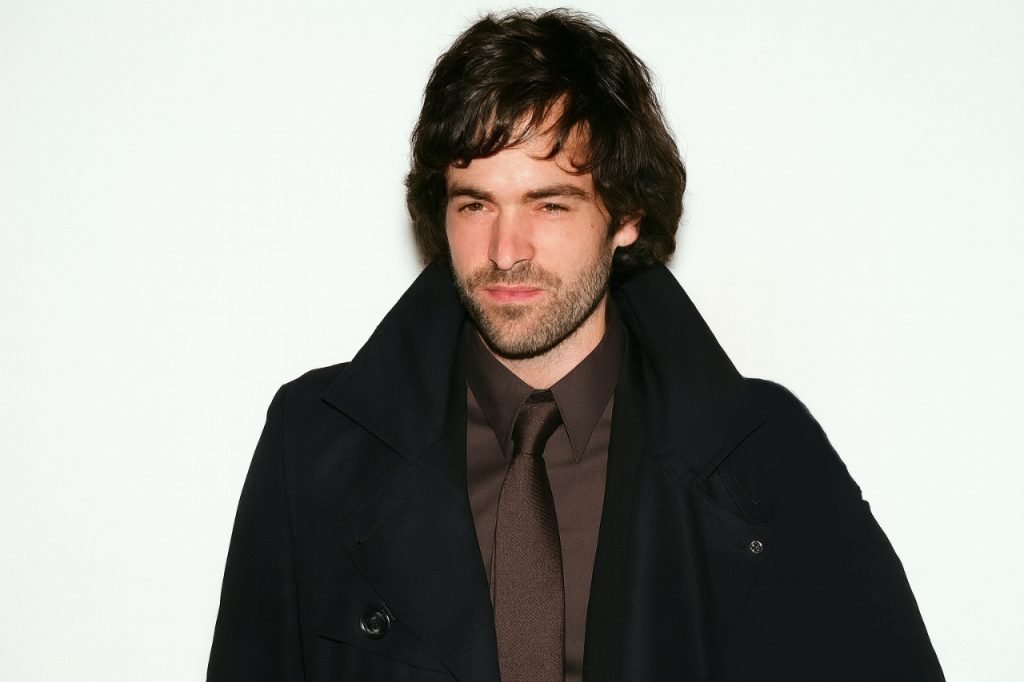 Murray Hone: Life, Career & Where He Is Now Middle-aged man standing outdoors near a brick building