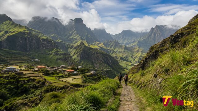 Paul Valley Santo Antão with green mountains, terraced farmland, villages, and hikers in Cabo Verde