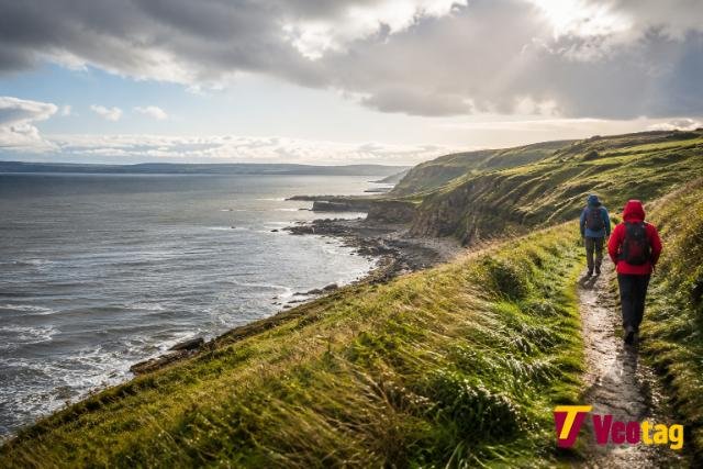 Hikers on the Fife Coastal Path near St Andrews, Scotland