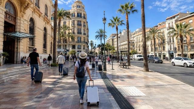 Traveler arriving near Centro-Alameda Station Málaga on a sunny spring morning.