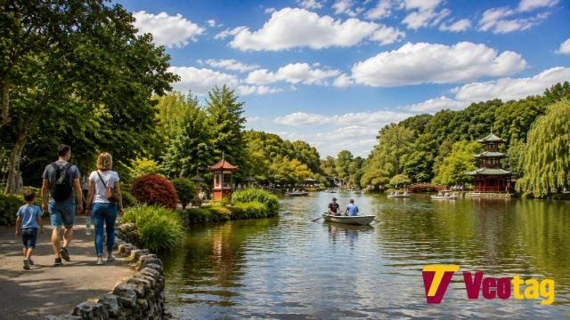 Peasholm Park Scarborough lake with Japanese pagoda, boats and families walking
