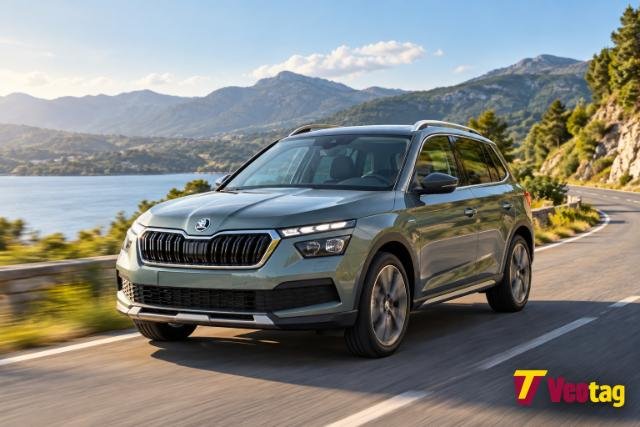 Skoda Kamiq driving on a scenic mountain road beside a lake.