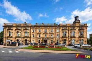Crown Hotel Harrogate: Rooms, Facilities, Location and Booking Guide Front exterior view of Crown Hotel Harrogate with its historic stone architecture and landscaped gardens.